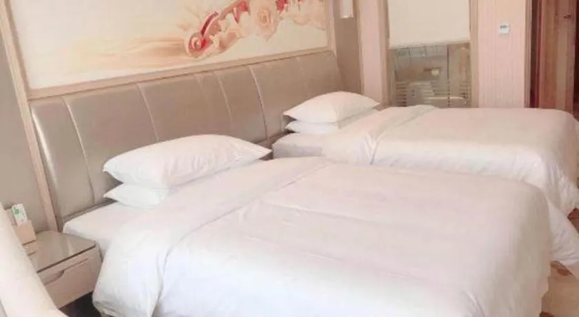 Bed in Vienna Hotel Guangxi Zhongshan Central Plaza West High-Speed Railway Station