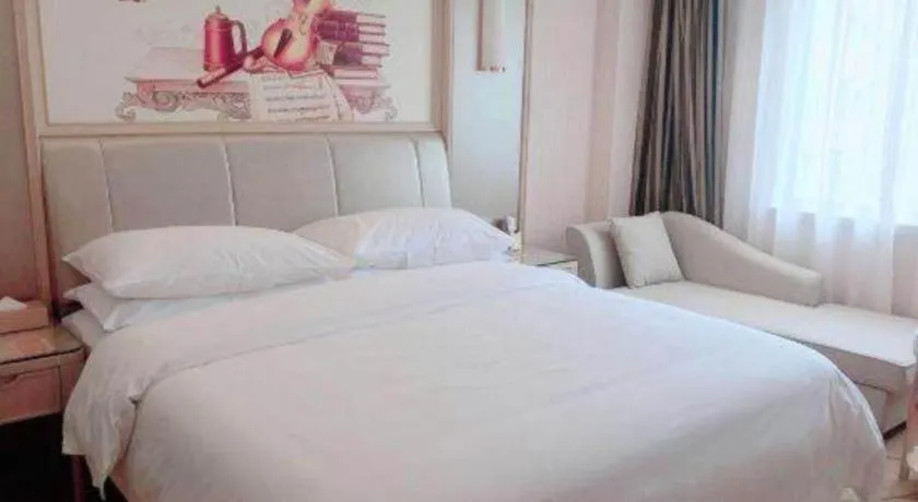 Bed in Vienna Hotel Guangxi Zhongshan Central Plaza West High-Speed Railway Station