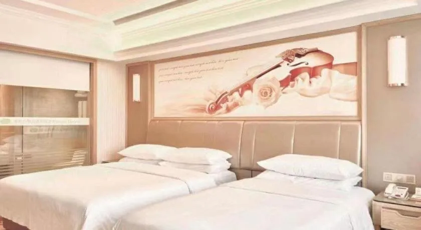 Bed in Vienna Hotel Guangxi Zhongshan Central Plaza West High-Speed Railway Station