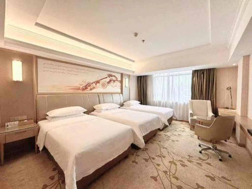 Bed in Vienna Hotel Guangxi Zhongshan Central Plaza West High-Speed Railway Station