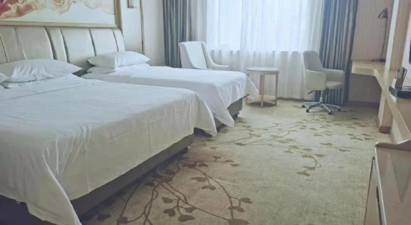 Bed in Vienna Hotel Guangxi Zhongshan Central Plaza West High-Speed Railway Station