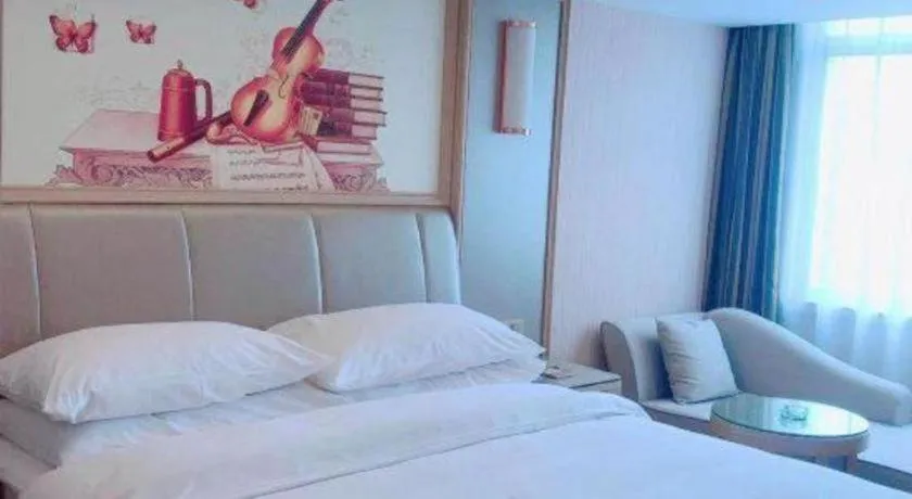 Bed in Vienna Hotel Guangxi Zhongshan Central Plaza West High-Speed Railway Station