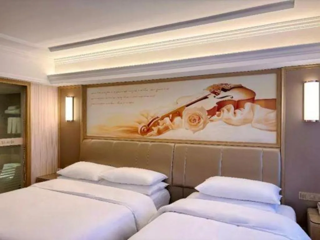 Bed in Vienna Hotel Guangxi Zhongshan Central Plaza West High-Speed Railway Station