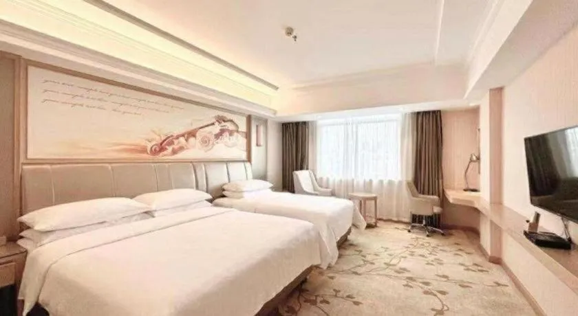 Bed in Vienna Hotel Guangxi Zhongshan Central Plaza West High-Speed Railway Station