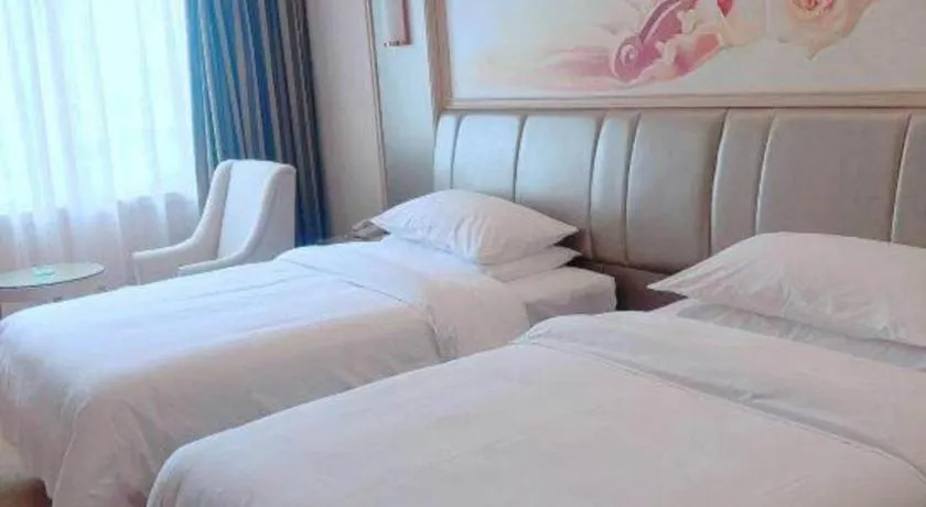 Bed in Vienna Hotel Guangxi Zhongshan Central Plaza West High-Speed Railway Station