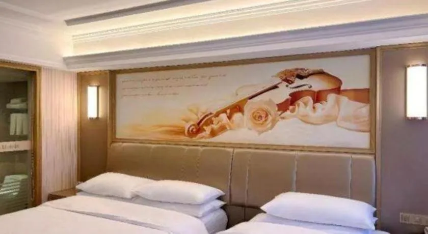 Bed in Vienna Hotel Guangxi Zhongshan Central Plaza West High-Speed Railway Station