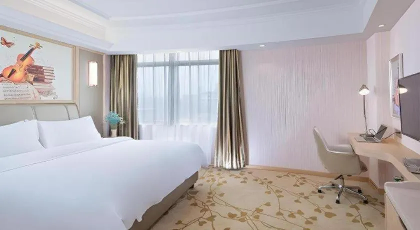 Bed in Vienna Hotel Guangxi Zhongshan Central Plaza West High-Speed Railway Station