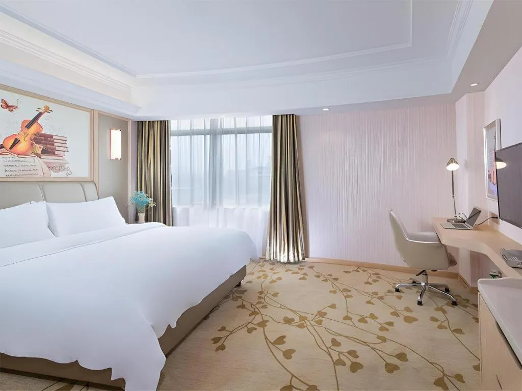 Bed in Vienna Hotel Guangxi Zhongshan Central Plaza West High-Speed Railway Station