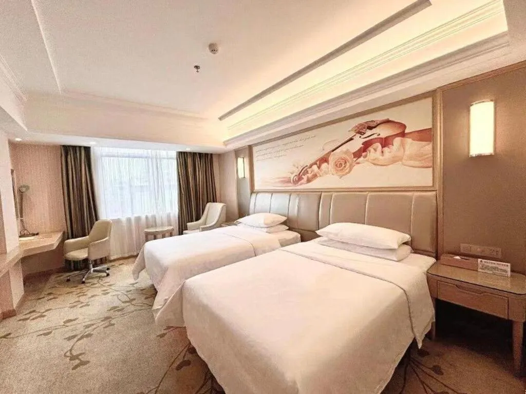Bed in Vienna Hotel Guangxi Zhongshan Central Plaza West High-Speed Railway Station