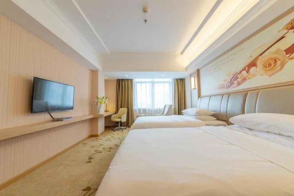 Bed in Vienna Hotel Guangxi Zhongshan Central Plaza West High-Speed Railway Station