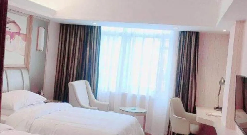 Bed in Vienna Hotel Guangxi Zhongshan Central Plaza West High-Speed Railway Station