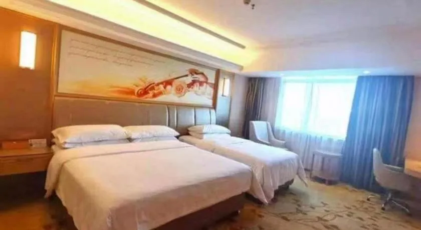 Bed in Vienna Hotel Guangxi Zhongshan Central Plaza West High-Speed Railway Station