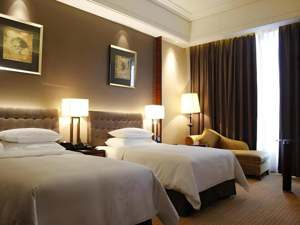 Bed in Venus Royal Hotel Shenzhen International Exhibition Center