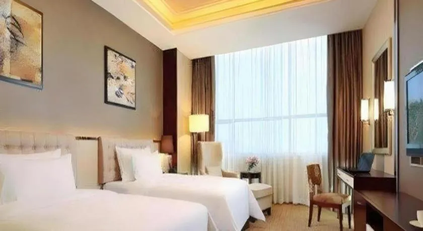 Bed in Venus Royal Hotel Shenzhen International Exhibition Center