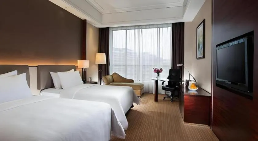 Bed in Venus Royal Hotel Shenzhen International Exhibition Center