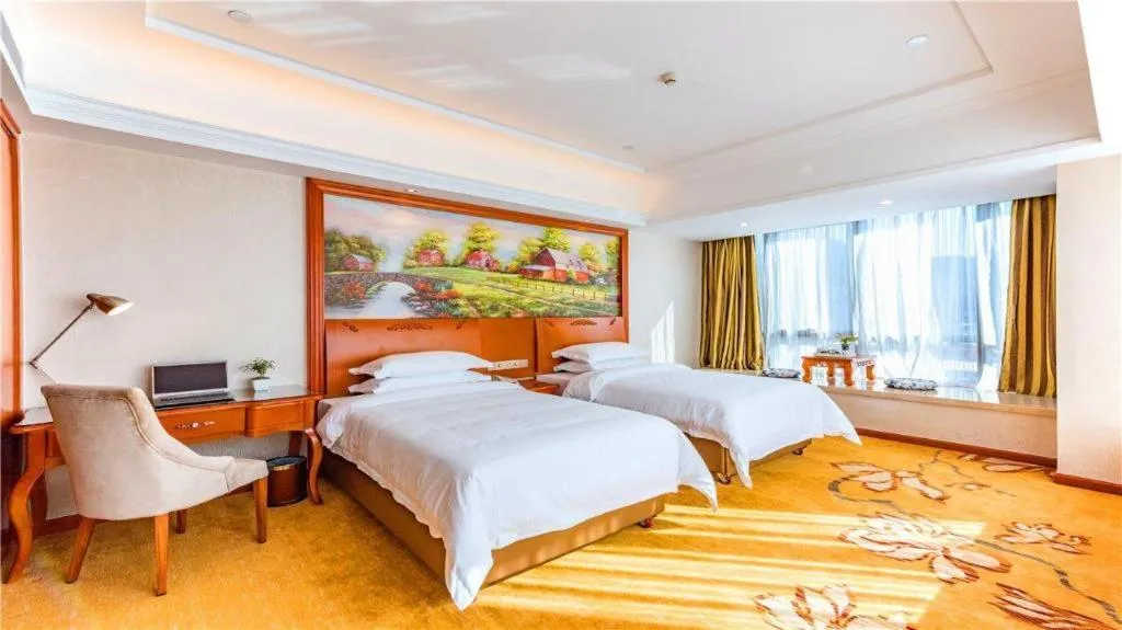 Bed in Vienna Hotel Fuzhou Changle Zhenghe Metro Station