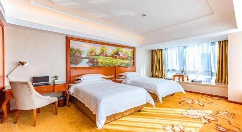 Bed in Vienna Hotel Fuzhou Changle Zhenghe Metro Station