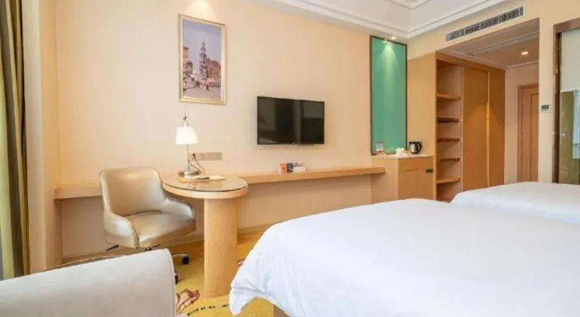 Bed in Vienna Hotel Fuzhou Changle Zhenghe Metro Station