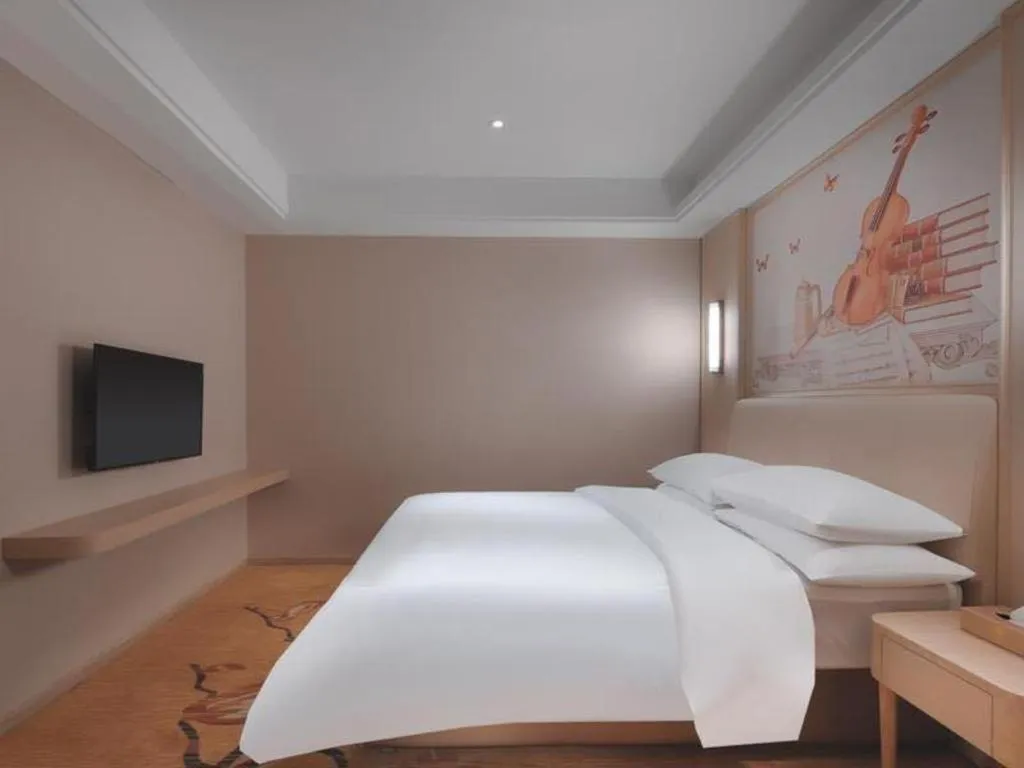 Bed in Vienna Hotel Zhejiang Tongxiang Puyuan