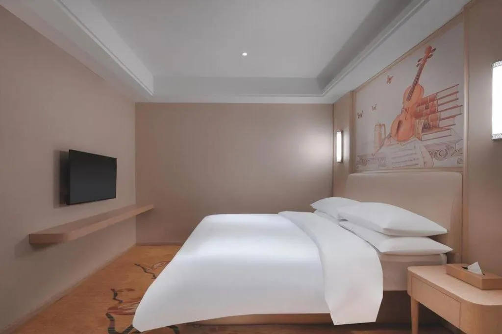 Bed in Vienna Hotel Zhejiang Tongxiang Puyuan