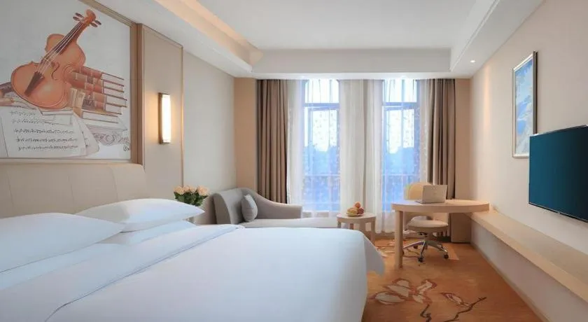 Bed in Vienna Hotel Zhejiang Tongxiang Puyuan