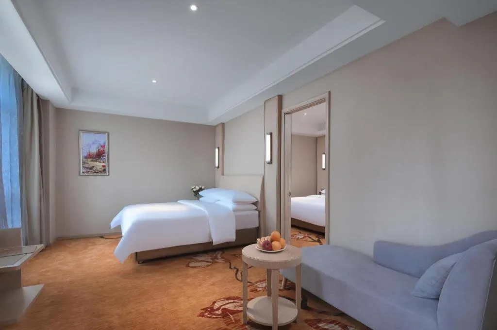 Bed in Vienna Hotel Zhejiang Tongxiang Puyuan