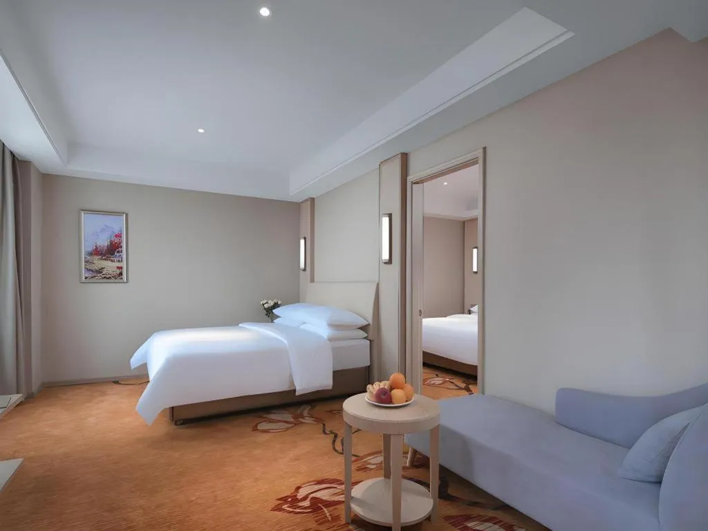 Bed in Vienna Hotel Zhejiang Tongxiang Puyuan