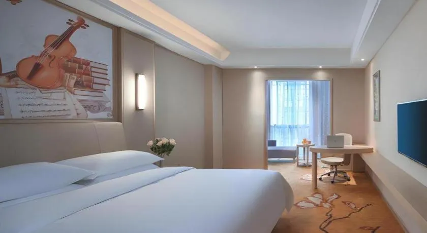 Bed in Vienna Hotel Zhejiang Tongxiang Puyuan