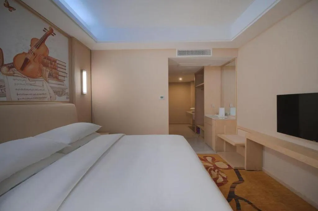 Bed in Vienna Hotel Zhejiang Tongxiang Puyuan