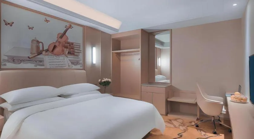 Bed in Vienna Hotel Zhejiang Tongxiang Puyuan