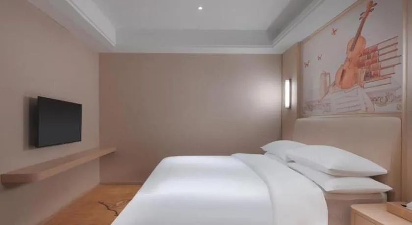 Bed in Vienna Hotel Zhejiang Tongxiang Puyuan