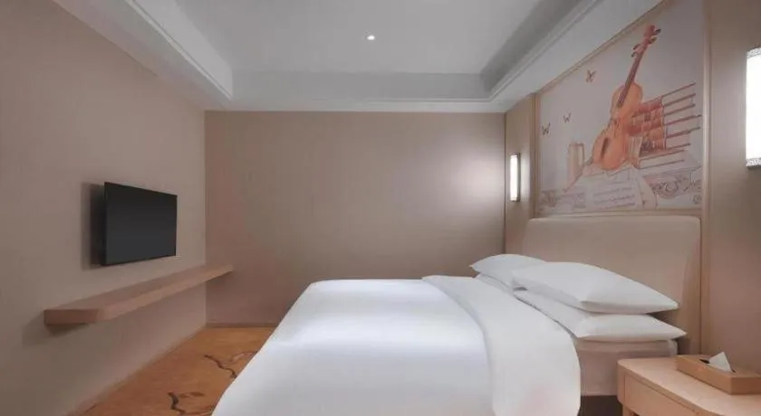 Bed in Vienna Hotel Zhejiang Tongxiang Puyuan