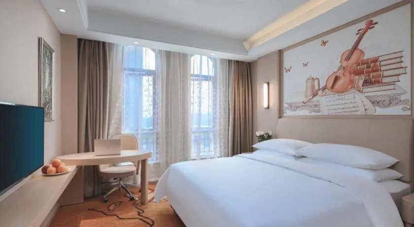 Bed in Vienna Hotel Zhejiang Tongxiang Puyuan