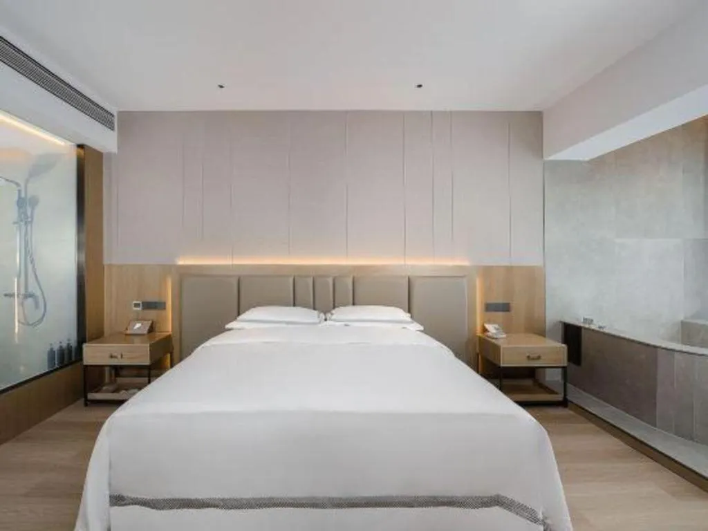 Bed in Vienna Hotel Yunnan Maitreya Huquan