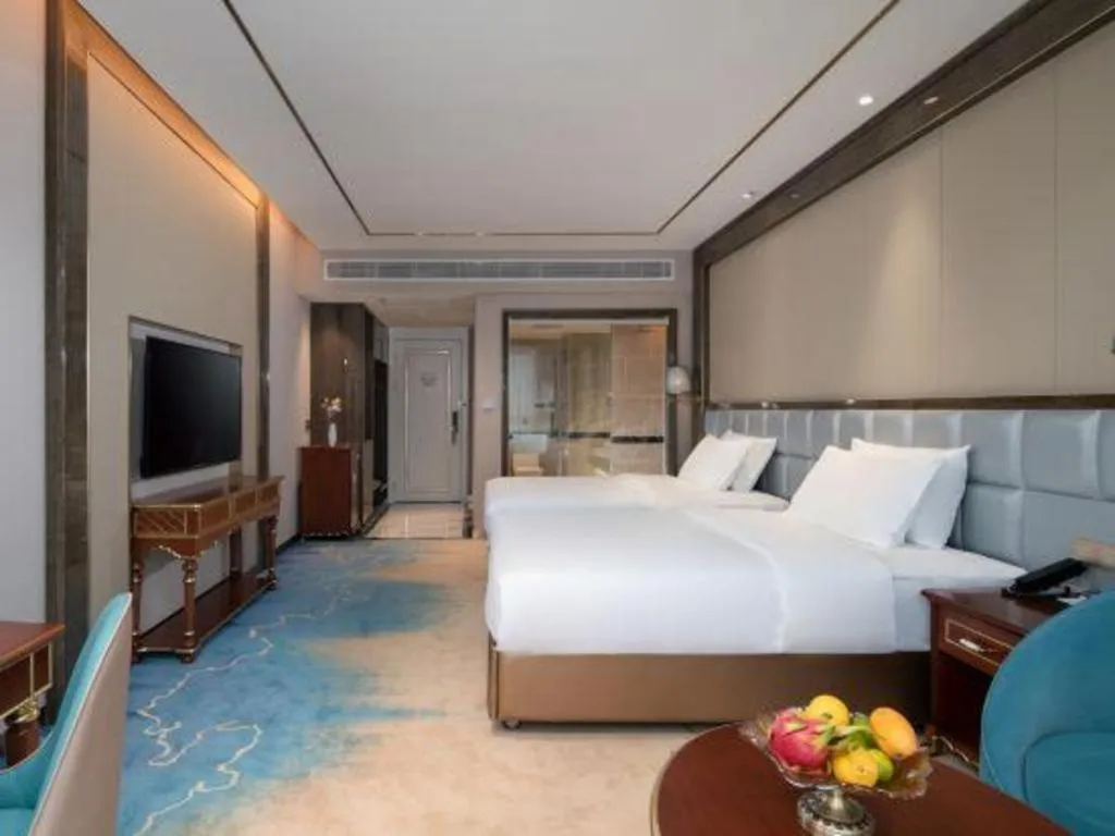 Bed in Vienna Hotel Yunnan Maitreya Huquan