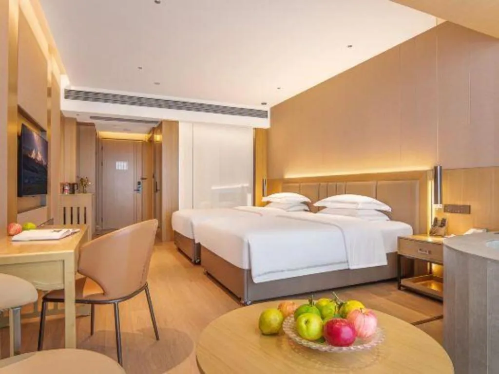 Bed in Vienna Hotel Yunnan Maitreya Huquan