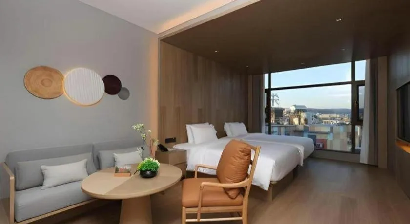 Bed in Vienna Hotel Yunnan Maitreya Huquan