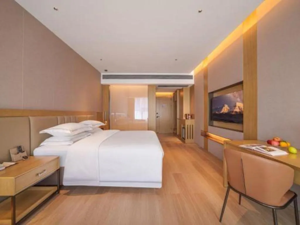 Bed in Vienna Hotel Yunnan Maitreya Huquan