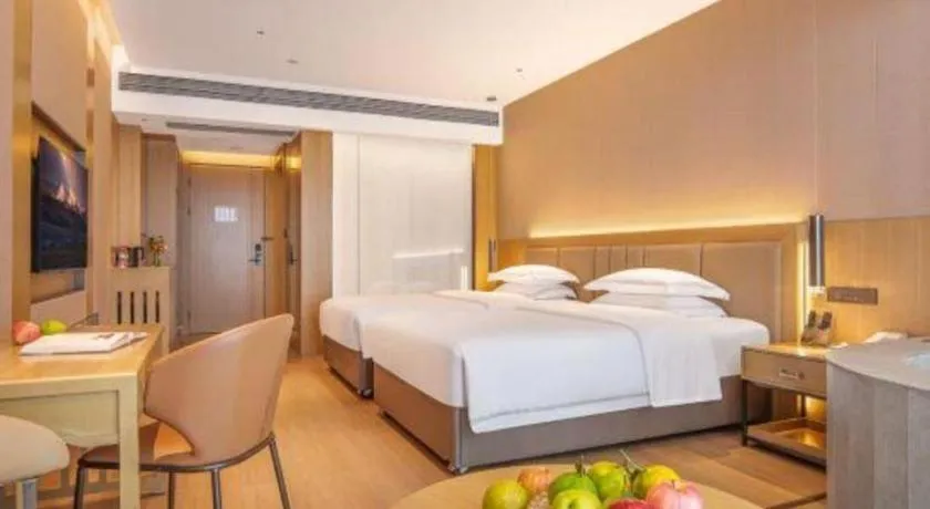 Bed in Vienna Hotel Yunnan Maitreya Huquan