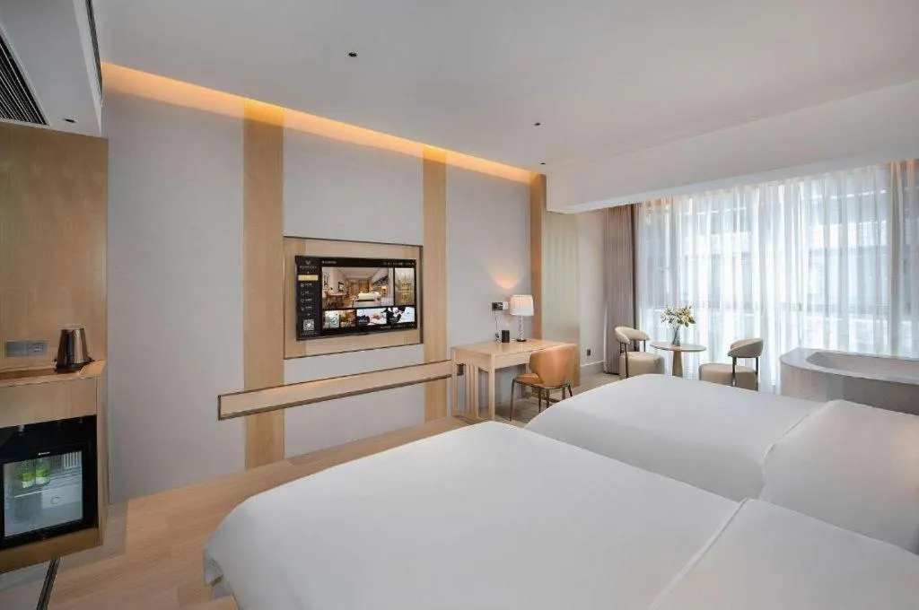 Bed in Vienna Hotel Yunnan Maitreya Huquan