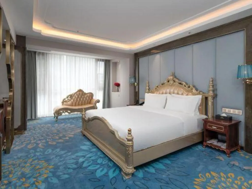 Bed in Vienna Hotel Yunnan Maitreya Huquan