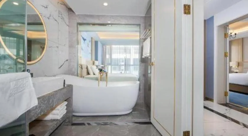 Bed in Vienna Hotel Yunnan Maitreya Huquan