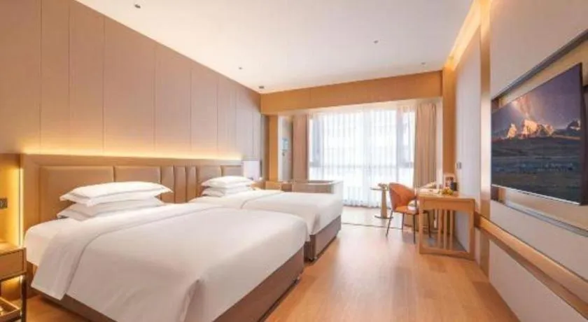 Bed in Vienna Hotel Yunnan Maitreya Huquan