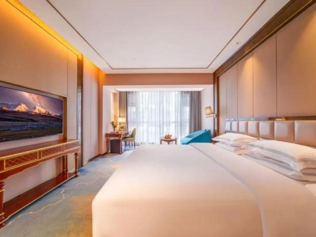 Bed in Vienna Hotel Yunnan Maitreya Huquan