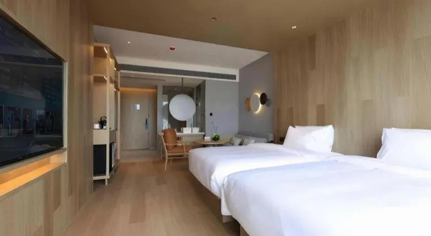 Bed in Vienna Hotel Yunnan Maitreya Huquan