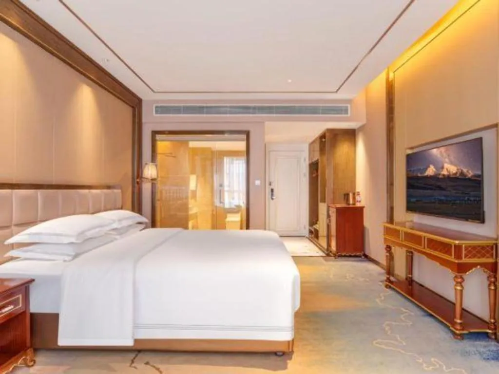 Bed in Vienna Hotel Yunnan Maitreya Huquan