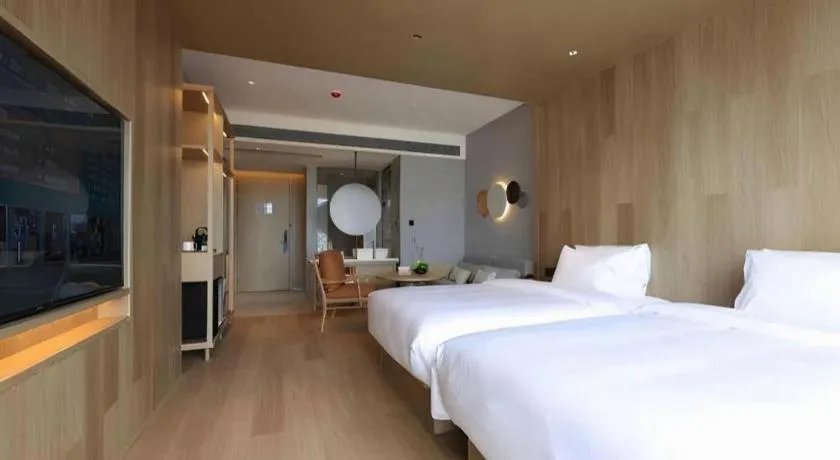 Bed in Vienna Hotel Yunnan Maitreya Huquan