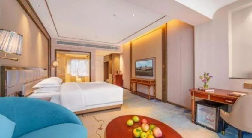 Bed in Vienna Hotel Yunnan Maitreya Huquan