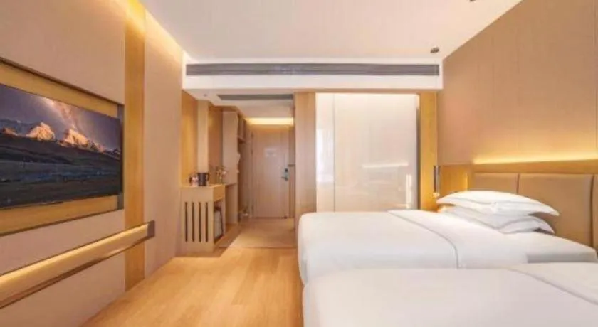 Bed in Vienna Hotel Yunnan Maitreya Huquan