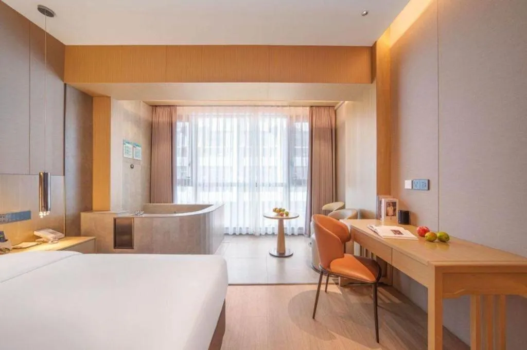 Bed in Vienna Hotel Yunnan Maitreya Huquan